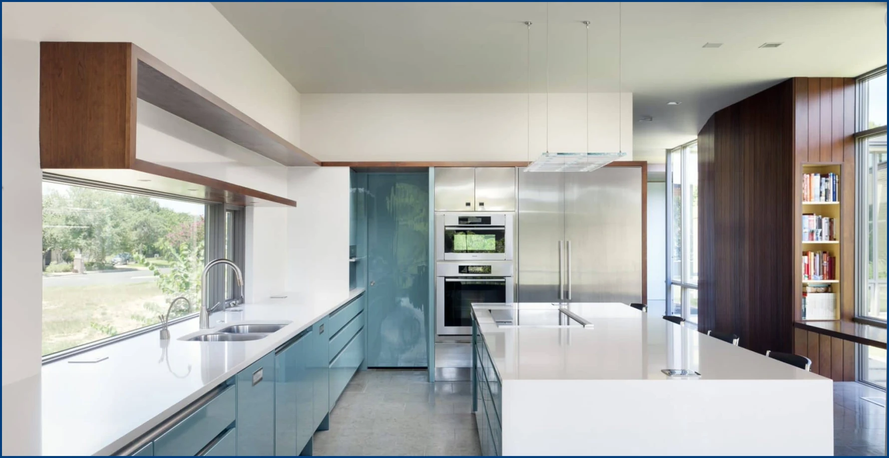 A modern kitchen with flat-panel white cabinets and white countertops in Milwaukee.