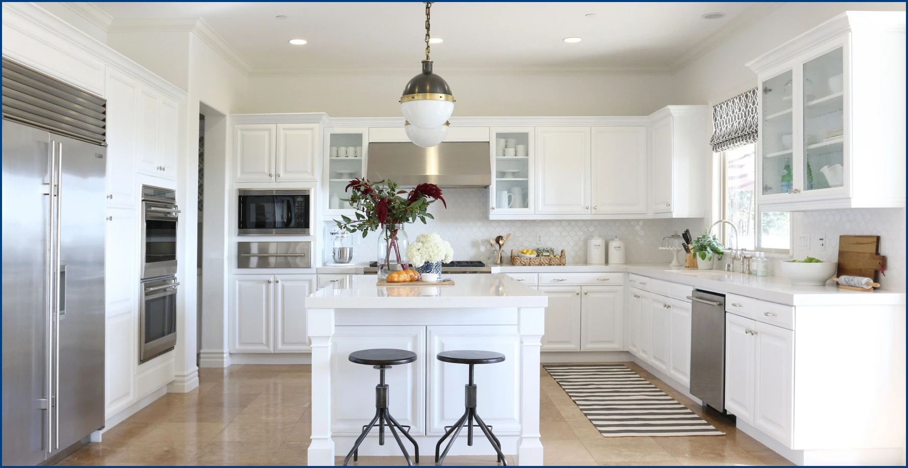 White kitchen cabinets with white countertops in Milwaukee kitchen.